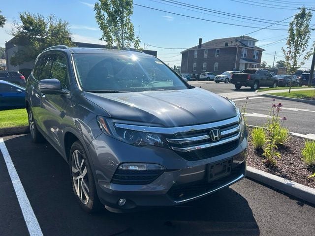 2016 Honda Pilot Elite in Modern Steel Metallic — front three-quarter view