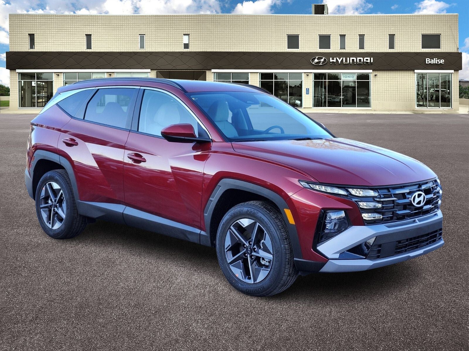 2026 Hyundai TUCSON SEL in Ultimate Red — front three-quarter view