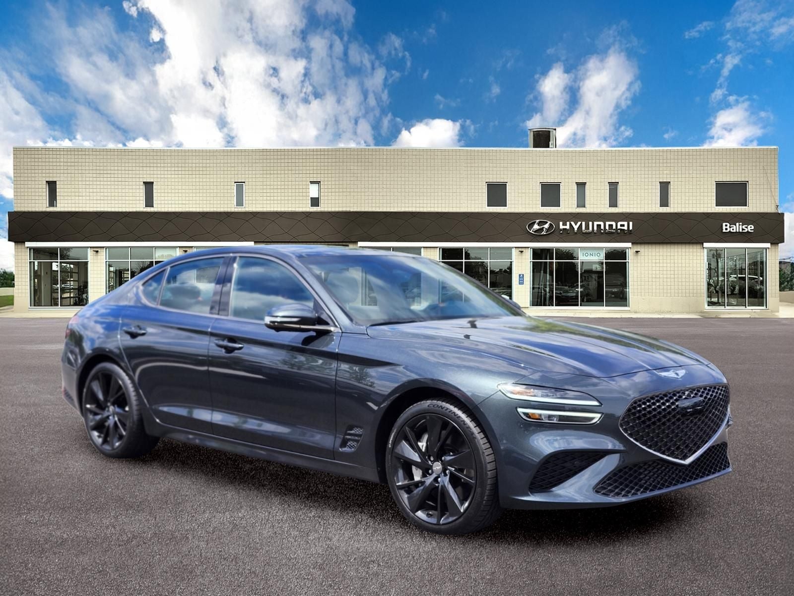 2023 Genesis G70 3.3T SPORT PRESTIGE in Hallasan Green — front three-quarter view