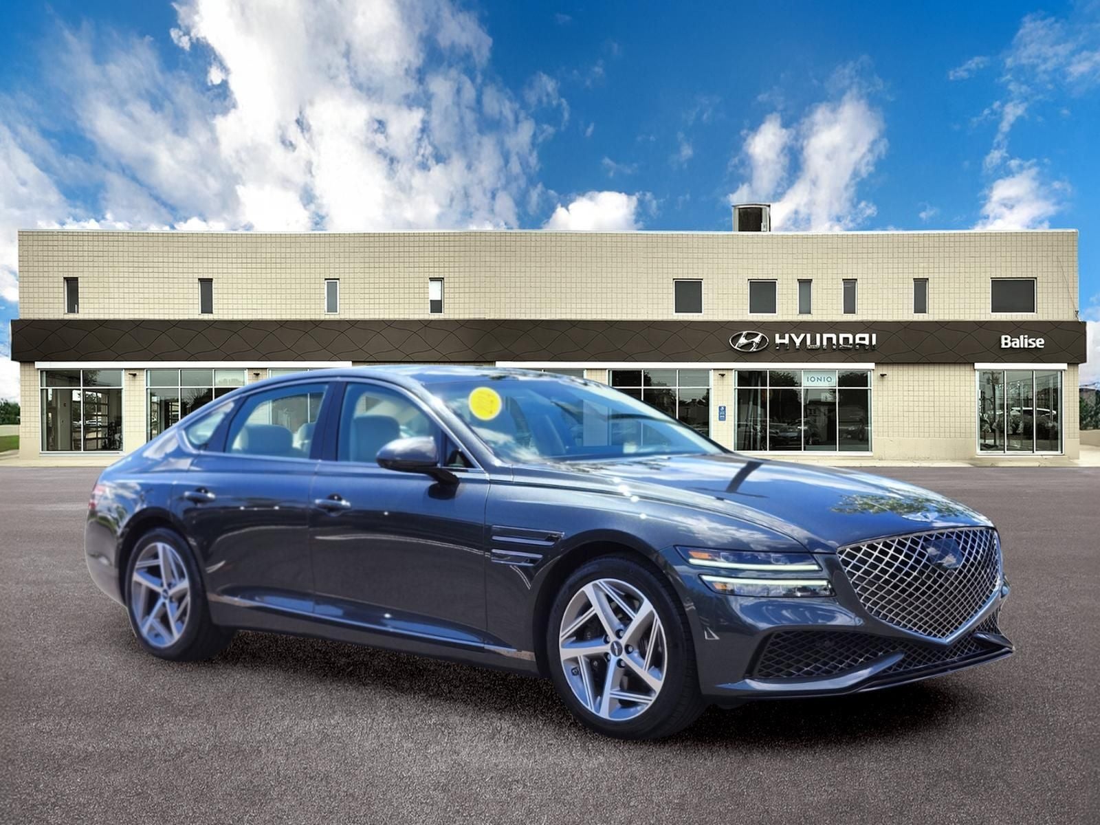 2024 Genesis G80 2.5T Sport Prestige in Hallasan Green — front three-quarter view