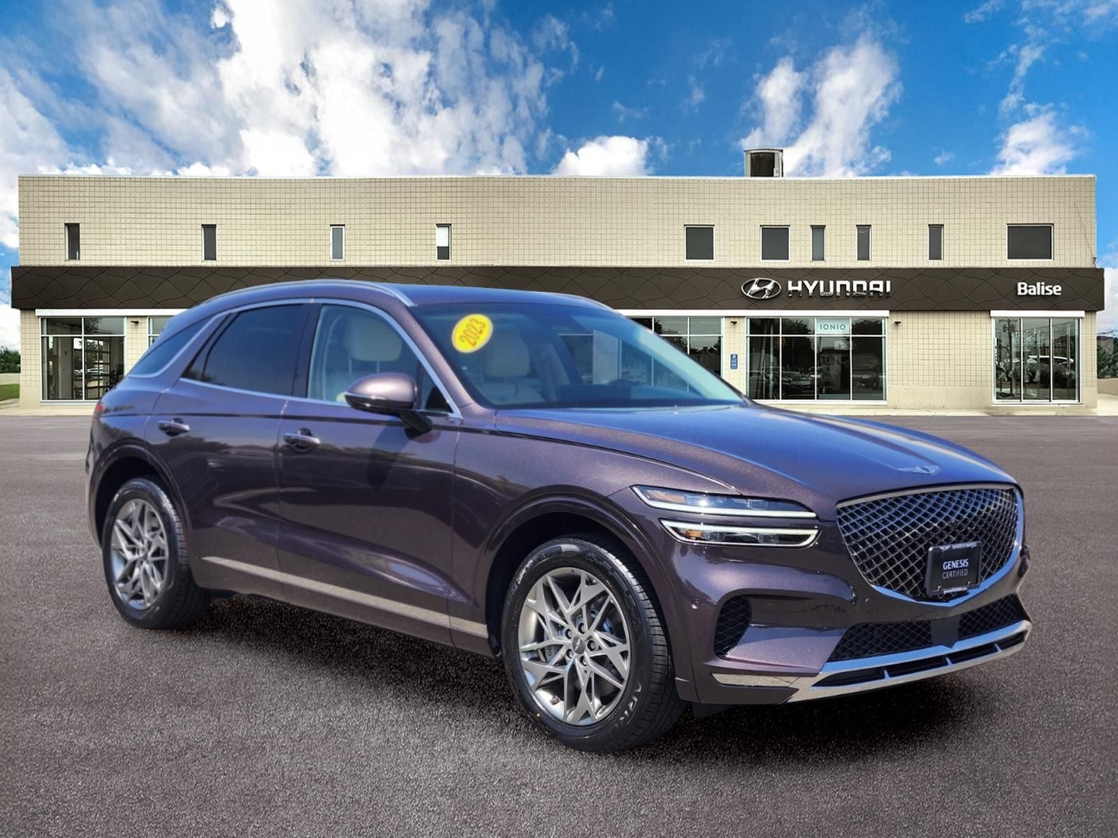 2023 Genesis GV70 2.5T ADVANCED PACKAGE in Burgundy — front three-quarter view