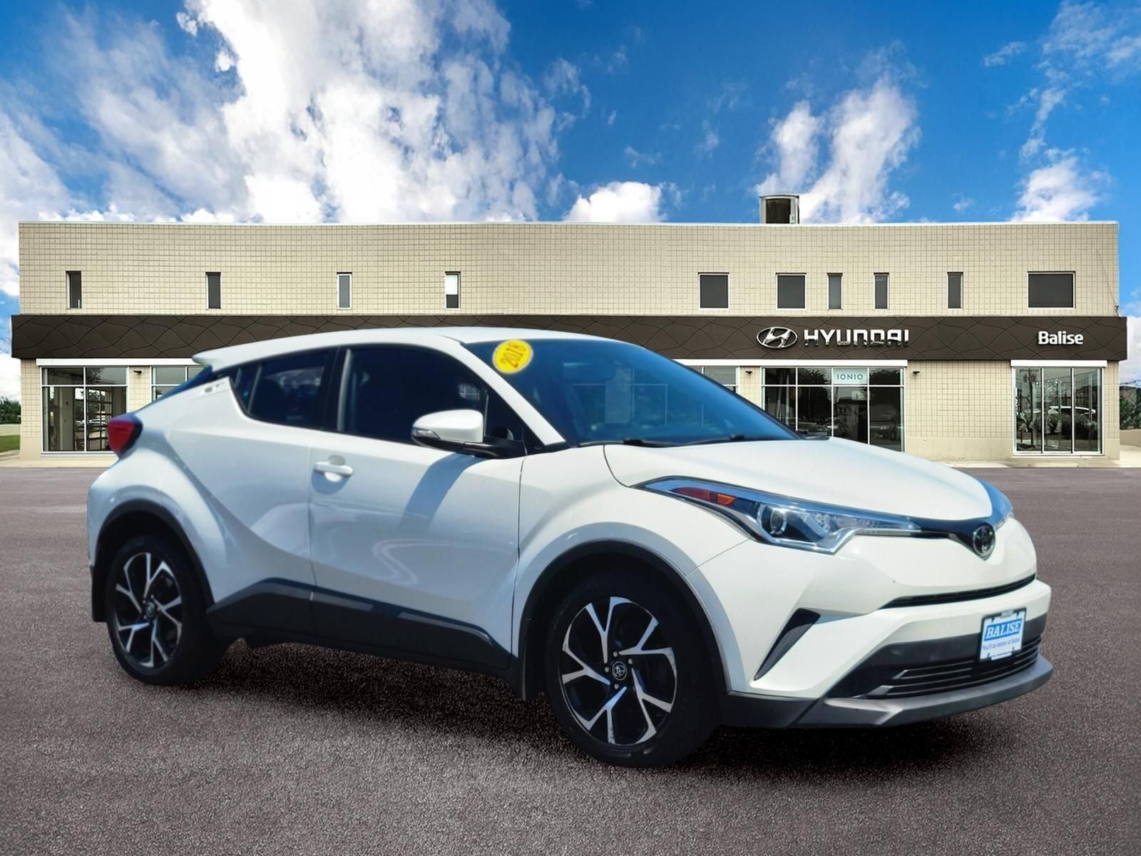 2018 Toyota C-HR XLE in Blizzard Pearl — front three-quarter view